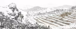 the hillside is covered with snow during the day