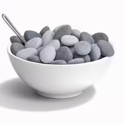 some rocks in a bowl on top of a table