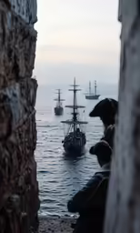 several ships going down the ocean in a body of water