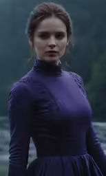 an attractive young woman in purple dress next to water