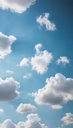 a cloudy blue sky with white clouds above it