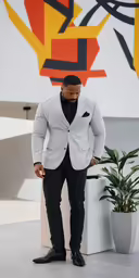 a man standing in front of a painting
