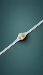 a large white spoon sitting on top of a table