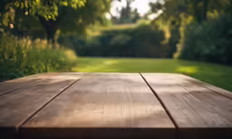 a wooden table with the back half covered by grass