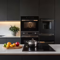 a kitchen with two stainless steel stoves and ovens