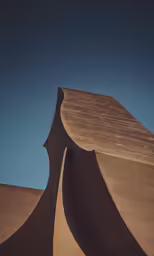 the top of a very large structure with a blue sky