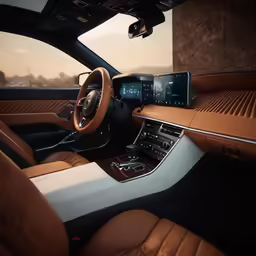 a car with beige seats and controls with tan leather trims