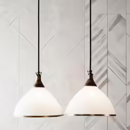 two lamps with a marble pattern in the back ground