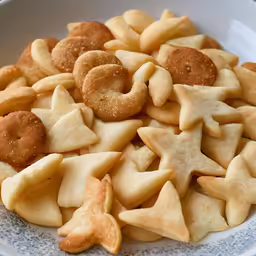star shaped cookies arranged in a white bowl