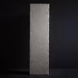 a tall concrete object with no base on a table