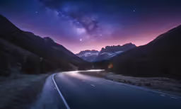 the stars shining brightly over the mountain range