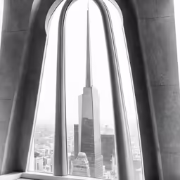 a very tall building near a big window