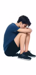 a person with their arms on his knees