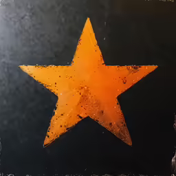 a yellow star painted on the side of a black wall