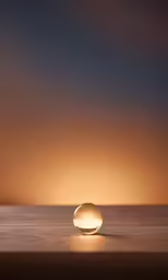 the light of the globe is illuminating against the background of a sunset sky