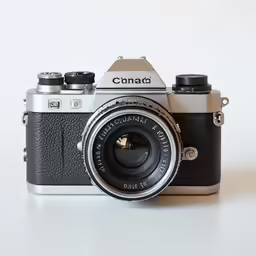 a compact camera with an old fashioned lens attached to it