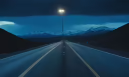 the road is wide and dark and empty