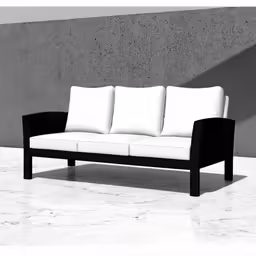 a black and white couch sitting on top of a marble floor