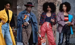 a group of women standing on the sidewalk