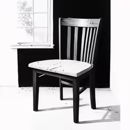 a chair next to a window in a room