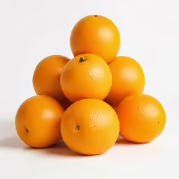a pile of ripe oranges sitting on top of each other