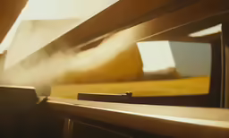 the sun shining behind a window and through a window sill