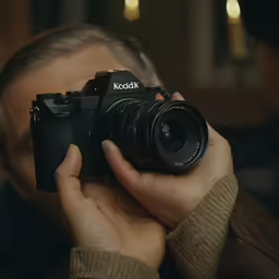 a man taking a picture of his camera