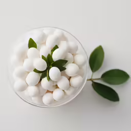 small pieces of white and green food in a bowl