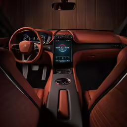 a car dashboard with red leather and the touch screen