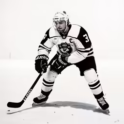 a hockey player skating on the ice in an ice rink