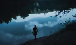 a man walking away from the camera across the water