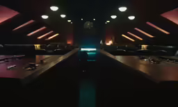 an empty bar with benches and tables in a room