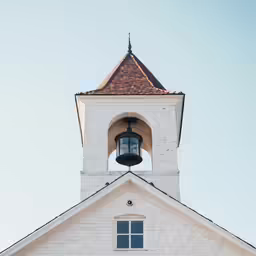 this is an image of a white church tower