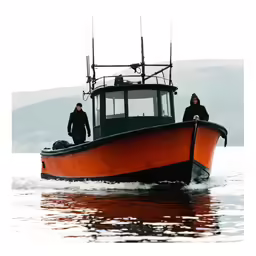 two men standing on the back of a red boat