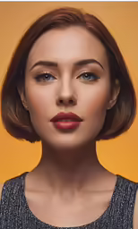 a woman in grey shirt with dark lipstick on yellow background