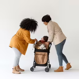 a woman pushing a stroller and two other women