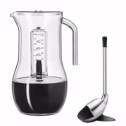 an image of a glass measuring cup and spoon