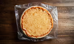 a whole pizza that is on top of plastic