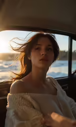 a woman sitting in the back of a car in front of a window
