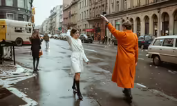 the women are crossing the street holding hands