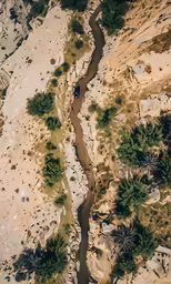 the water is running through a valley of dry rocks