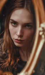 a woman is seen through a round mirror