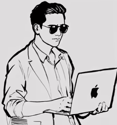 a man using an apple mac laptop on his lap