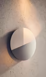 a light fixture is shown against a concrete wall