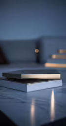 an open book on a table near some couches