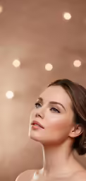 a young woman looking up with light shining in the background