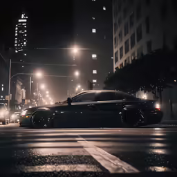 a black car is parked at a street light in the rain