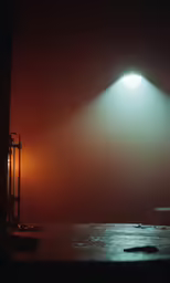 an empty room that has a light on