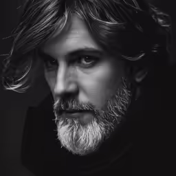 long haired man with beard and thick hair