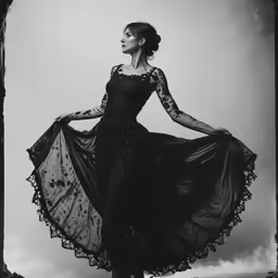 a woman is wearing a lace dress in an artistic way